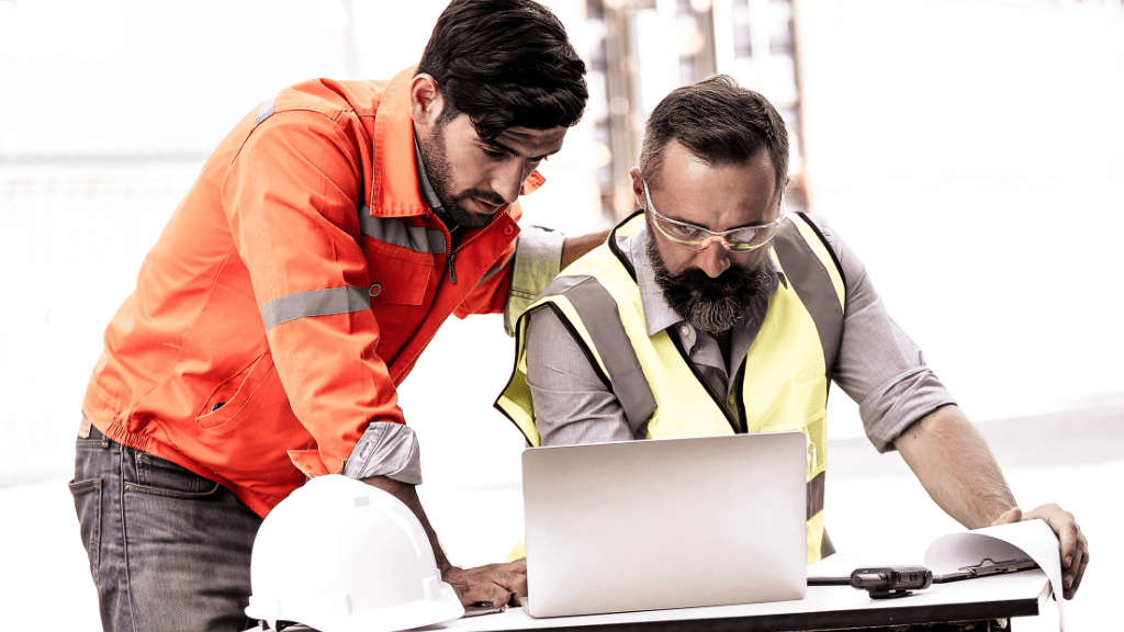 two builders working with construction operations software